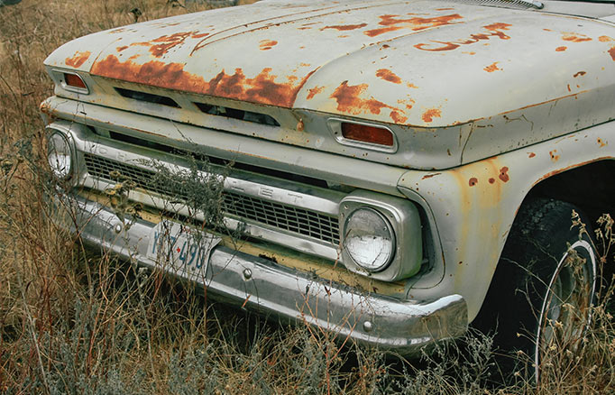 A worn-out pickup truck for recyling